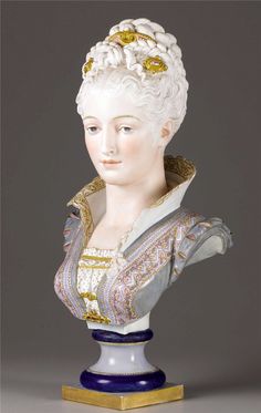 a busturine of a woman with white hair