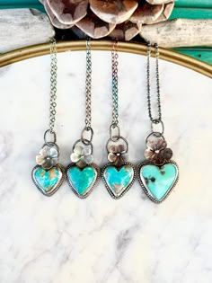 Turquoise Heart Necklace, Blue heart Necklace, Turquoise flower necklace, Turquoise Heart Pendant, Valentines Pendant, Valentines Necklace Fresh off the bench and one of my most popular styles! These beauties make a perfect gift for a loved one or yourself! :) I handcraft each and every piece I make from start to finish:  This includes soldering, stone setting, sawing, hammering, filing and finishing. I made these gorgeous little flower pendants with solid sterling silver that I had cut and stam Turquoise Heart Necklace, Handmade Silver Jewellery, Valentines Necklace, Dope Jewelry, Classy Jewelry, Gems Jewelry