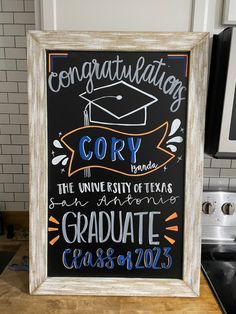 a chalkboard sign that reads congratulating cor the university of texas graduate class of 2013