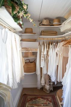 the closet is full of clothes and hats