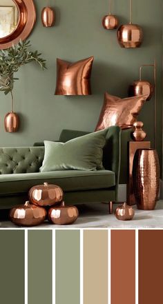 a living room with green walls and copper accents