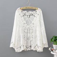 This sassy but sweet floral lace kimono is simply chic.  The delicate lace detail is absolute perfection.  Made with a polyester and cotton blend this light and breezy kimono is the perfect jacket to wear over a cami also could function beautifully as a beach cover-up. White Lace Blouse, Shawl Cardigan, Lace Kimono, Kimono Cardigan, Cotton Blouse, Lace Fashion, White Blouse, Women Lace, Lace Blouse