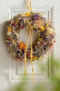 a dried wreath hangs on the front door