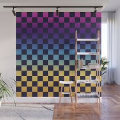 a room with a large wall mural in purple, yellow and black checkerboard