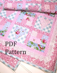 a pink and blue quilted table runner with the words pdf pattern on it