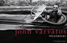 a man in a car with the caption john varvatos show us your peace sign with peace rocks