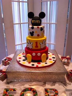 a mickey mouse cake on top of a table