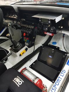 the interior of a race car with electronic controls