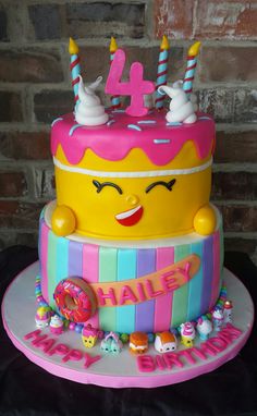 a birthday cake decorated with candy and candles