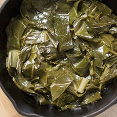 cooked collard greens in a skillet on a table