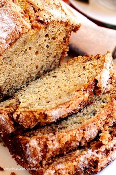 sliced loaf of banana bread sitting on top of a white plate