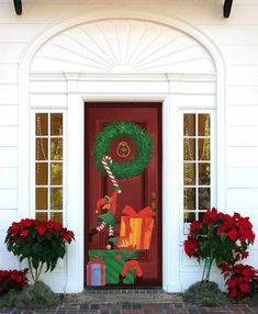 the front door is decorated with christmas decorations