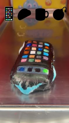 a cell phone cake sitting on top of a table