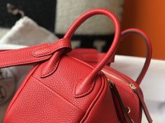 Hermes Lindy Mini Clemence Bag Red For Women, Women’s Handbags, Shoulder And Crossbody Bags 7.5in/19cm Rep 1:1 Size: 19 x 12.5 x 9 cm / 7.5 x 5 x 3.5 inches (Length x Height x Width) The mini Lindy bag made its debut at the Hermès Fall/Winter 2019 runway show. The Mini Lindy is true to its roots: it essentially functions as any Lindy bag, with the added bonus of a cross-body strap (so it’s extra-practical). The unusual placement of the handles gives the bag its atypical shape, and you can carry Hermes Lindy Mini, Mini Lindy, Hermes Lindy, 2019 Runway, Gucci Gg Marmont, Reversible Belt, Luxury Products, Evening Clutch Bag, Runway Show