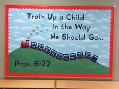 a bulletin board with train up a child in the way he should go written on it