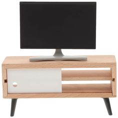 a computer monitor sitting on top of a wooden stand