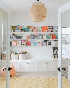 a room with bookshelves and toys in it