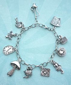 this charm bracelet features Alice in wonderland inspired tibetan silver charms (nickel free). the charms are attached to a silver tone 7.5 inches chain bracelet with lobster clasp closure. Alice In Wonderland Inspired, Looks Country, Bracelet Pandora, Alice In Wonderland Party, Wonderland Party, Disney Jewelry, Silver Charm Bracelet, Pandora Bracelets, Pandora Jewelry