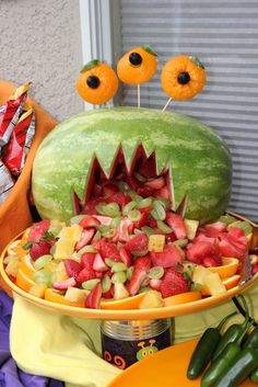 a watermelon shaped like a monster with its mouth open