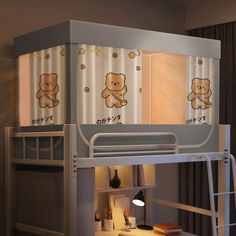 there is a bunk bed with a teddy bear on the top and below it, next to a window