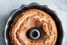 a bundt cake in a round pan with a metal ring on the top and bottom