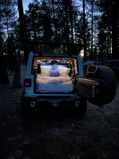 the bed in the truck is lit up with lights