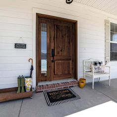 a welcome mat on the front porch of a house