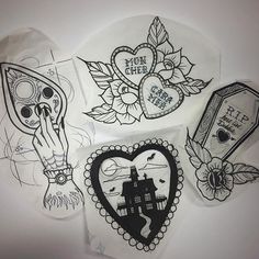 some stickers that are on the side of a white wall with black and white designs