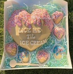 an ice cream box with frosting and sprinkles on it that says lick me till ice cream