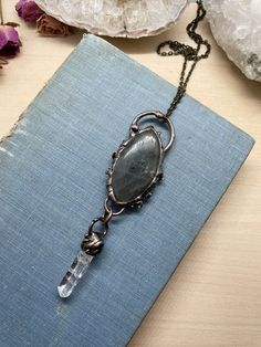 "This listing is for one electroplated statement necklace featuring labradorite and quartz. It's beautiful and unique, and gives off major Dark Crystal vibes! You may pick the chain length at check out. I recommend between 18-24\" for this necklace, but can do any length from 14-30\". The chain itself may be slightly different than the one in the photograph, depending on what supplies I have available when you order. The chain is nickel, lead, and cadmium free. Your necklace will be stored in a Electroformed Labradorite Necklaces For Healing, Spiritual Bronze Labradorite Necklace, Mystical Hand Forged Labradorite Necklace, Crystal Vibes, Earring Hole, Dark Crystal, The Dark Crystal, Labradorite Necklace, Labradorite Necklaces