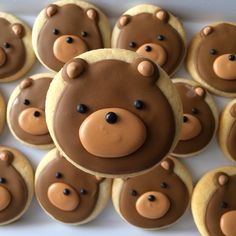 there are many cookies with chocolate teddy bears on them in the shape of bear heads