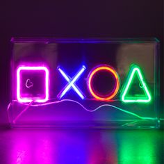 a neon sign with the word xoxo on it in front of a black background