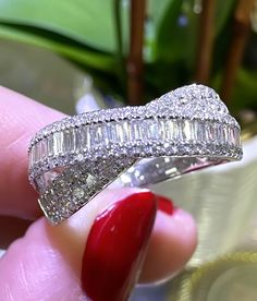 This 1.11ct tw diamond baguette and round cut criss cross ring is a stunning statement piece that will add a touch of elegance to any outfit. Featuring a unique criss cross design, this ring showcases 1.11ct tw of dazzling diamonds in both baguette and round cuts. Elevate your style with this beautiful and timeless accessory. Metal: 18K White GoldRound Brilliant-cut 98 Diamonds: 0.39ct t.w., 30 Baguette cuts 0,72ct tw Width: 9mm For desired ring size please leave us a note at the check out. Necklace Guide, Criss Cross Ring, Diamond Initial Necklace, Diamond Baguette, Jewelry Appraisal, Bridal Engagement Rings, Cross Ring, Jewelry Rings Diamond, Cross Design