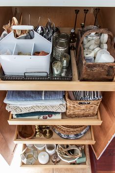 an organized drawer with baskets and other items