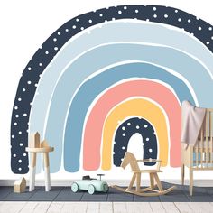 a child's room with a rainbow wall mural and rocking horse in the foreground