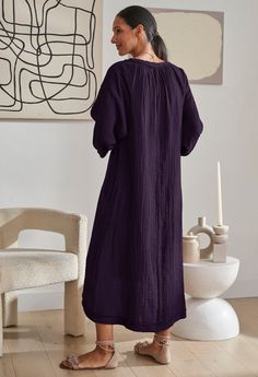 Eco friendly caftans and tunics inspired by the ocean, made on main street. Ethically sourced and locally made in Los Angeles. Deep and rich, our new Eggplant color is the perfect transition hue. Our best selling dress in this seasonless-deep purple color is perfect for fall and winter. Wear with sandals in the summer, pair it with booties in cooler months, this one will be in heavy rotation year around. Made of the most luxe double gauze fabric, this 100% cotton dress is the ultimate wardrobe staple. Flowing and easy, it's as comfortable as it gets. With pockets, of course, and a flattering asymmetric hem and deconstructed trim details, once it's on, we dare you to take it off. Sheerness: none Fabric: 100% Cotton Model height: 5'10"Model wearing size s/m. Care: Machine wash, hang or lay f Cotton Dress Outfit, Aubergine Color, Cotton Gauze Dress, Muslin Dress, Eggplant Color, Deep Purple Color, Double Gauze Fabric, Gauze Dress, By The Ocean