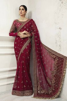 The latest Pakistani Wedding Maroon Red Saree Dress is a traditional yet classy choice for a Bride for her big day. This breathtaking Bridal Saree has a premium quality Chiffon fabric and is perfectly stitched according to the customer's demand. Embroideries and embellishments enhance the glamour of this Saree Dress. Red Sari, Saree Ideas, Designer Sarees Wedding, Red Bridal Dress, Fancy Sarees Party Wear, Saree Designs Party Wear, Maria B, Pakistani Bridal Dresses, Party Kleidung