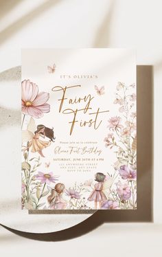 the fairy first birthday party card is shown on a plate with flowers and butterflies around it