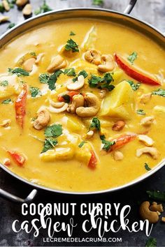 coconut curry cashew chicken in a pan with cashews and cilantro