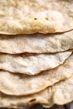 a stack of tortillas sitting on top of a table