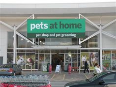 pets at home pet shop and pet grooming store with cars parked in the driveway