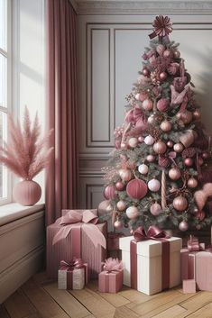 a decorated christmas tree with pink ornaments and presents in front of it, next to a window