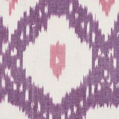 a purple and white pattern on fabric