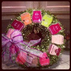 a christmas wreath decorated with tags and ribbons