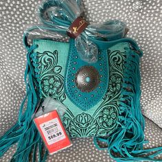 Brand New Montana West Cross Body Bag With Fringe And Tooling Bohemian Turquoise Rectangular Shoulder Bag, Turquoise Bohemian Shoulder Bag, Bohemian Blue Bags As Fashion Accessory, Bohemian Turquoise Shoulder Bag, Turquoise Tote Shoulder Bag With Adjustable Strap, Bohemian Turquoise Crossbody Bag, Turquoise Pouch Shoulder Bag For Travel, Blue Festival Shoulder Bag With Adjustable Strap, Turquoise Bags For Festivals