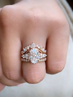 a close up of a person's hand with a ring on top of their finger