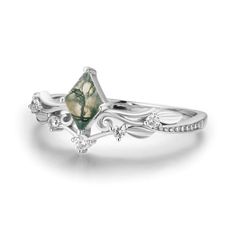 Our Victorian Lace Moss Agate Ring© encourages you to embrace your femininity within. This delicate ring features a rhombus-shaped moss agate stone sitting at the center of a spiral leaf design embellished by gemstones giving a feminine edge. May this ring allow you to reclaim your light as you rule the world with compassion and love.✦ Available in both 14K white gold vermeil (14K white gold plated over a sterling silver base) and 10K solid white gold. Silver Moss Agate Ring, Moss Agate Ring Eden Garden Jewelry, Elegant Handmade Moss Agate Rings, Nature-inspired Moss Agate Rings, Bff Rings, Luxury Moss Agate Nature-inspired Rings, Moss Agate Ring, Victorian Lace, Vintage Diamond Rings