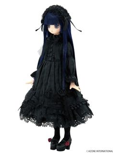 a doll with blue hair wearing a black dress and long horns on it's head