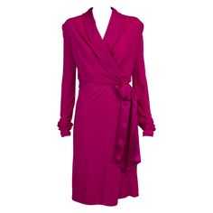 Effortlessly chic, this early 2000 Yves Saint Laurent by Tom Ford wrap dress will deliver glamour and sophistication for any occasion. Cut from comfortable vibrant fuchsia crepe-viscose, it has a plunging V-neckline and satin-silk waist sash ties to ensure the most flattering fit. Partially lined the dress is approximately a size S (US 4) but runs slightly big to size. Style it with stilettos and a small clutch. Remarks : - same dress in black colour is available for sale as well - circa 2000 Bu Ysl Dress, Silk Clutch, Sarah Jessica Parker, Carrie Bradshaw, Silk Satin, Tom Ford, Day Dresses, Clothes For Sale, Yves Saint Laurent