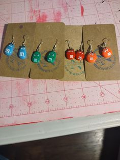 M&M faces in bright colors 3 orange, 1 blue, 1 green , 2 red Casual Colorful Earrings As A Gift, Personalized Multicolor Drop Earrings, M&m Earrings, Playful Personalized Multicolor Earrings, Playful Multicolor Personalized Earrings, M&m Characters, Jewelry Earrings Dangle, Etsy Earrings, Dangle Drop Earrings